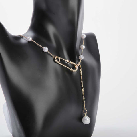 White pearl pendant necklace with golden chain and crystal safetypin for women's accessories by Bentati Fashion Dubai